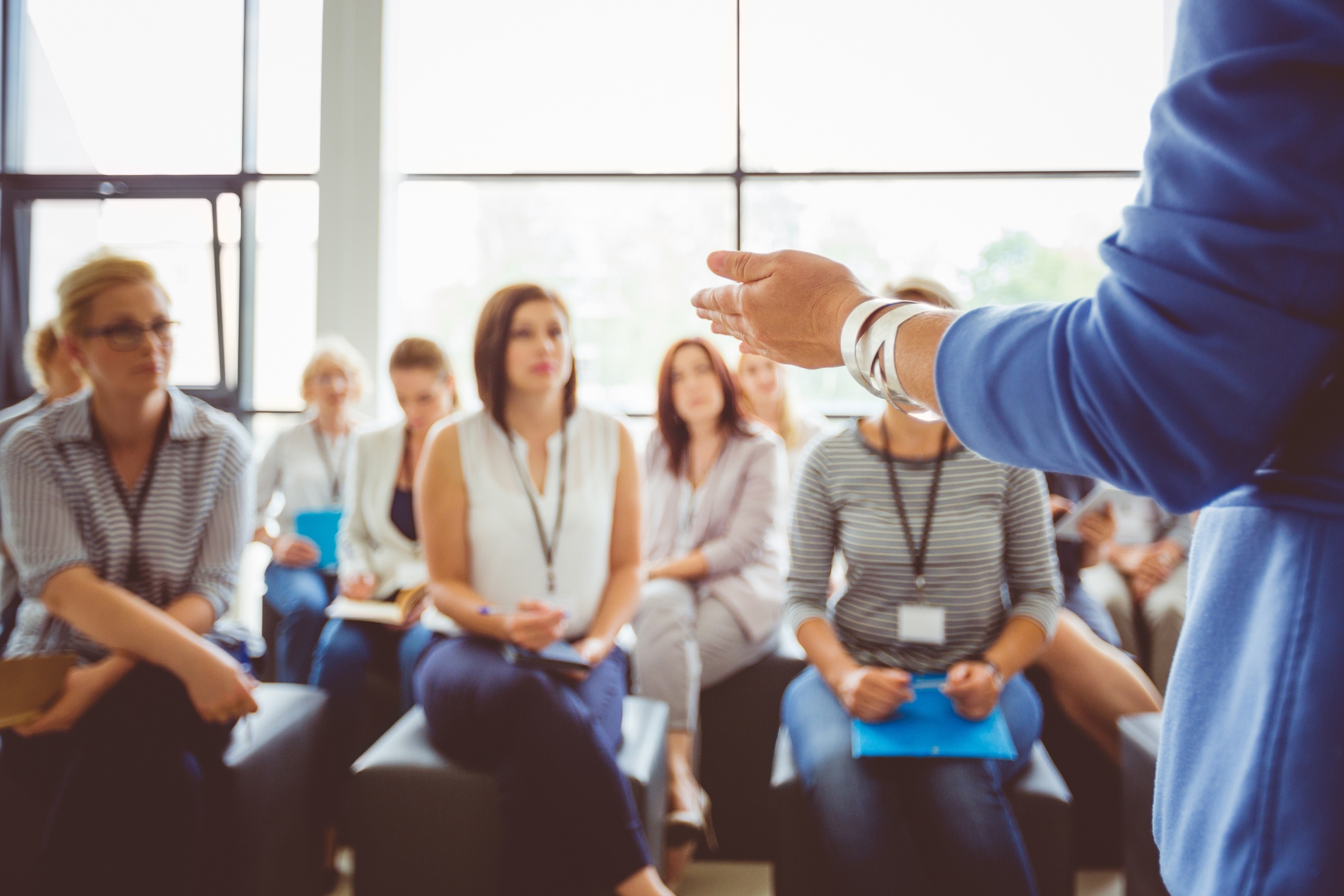 person speaking to group of people